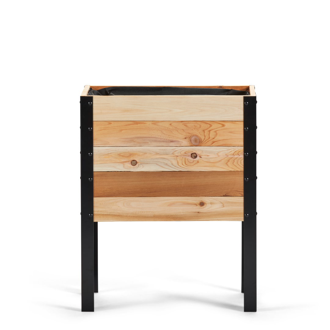 Wooden planter box with black metal frame on a white background
