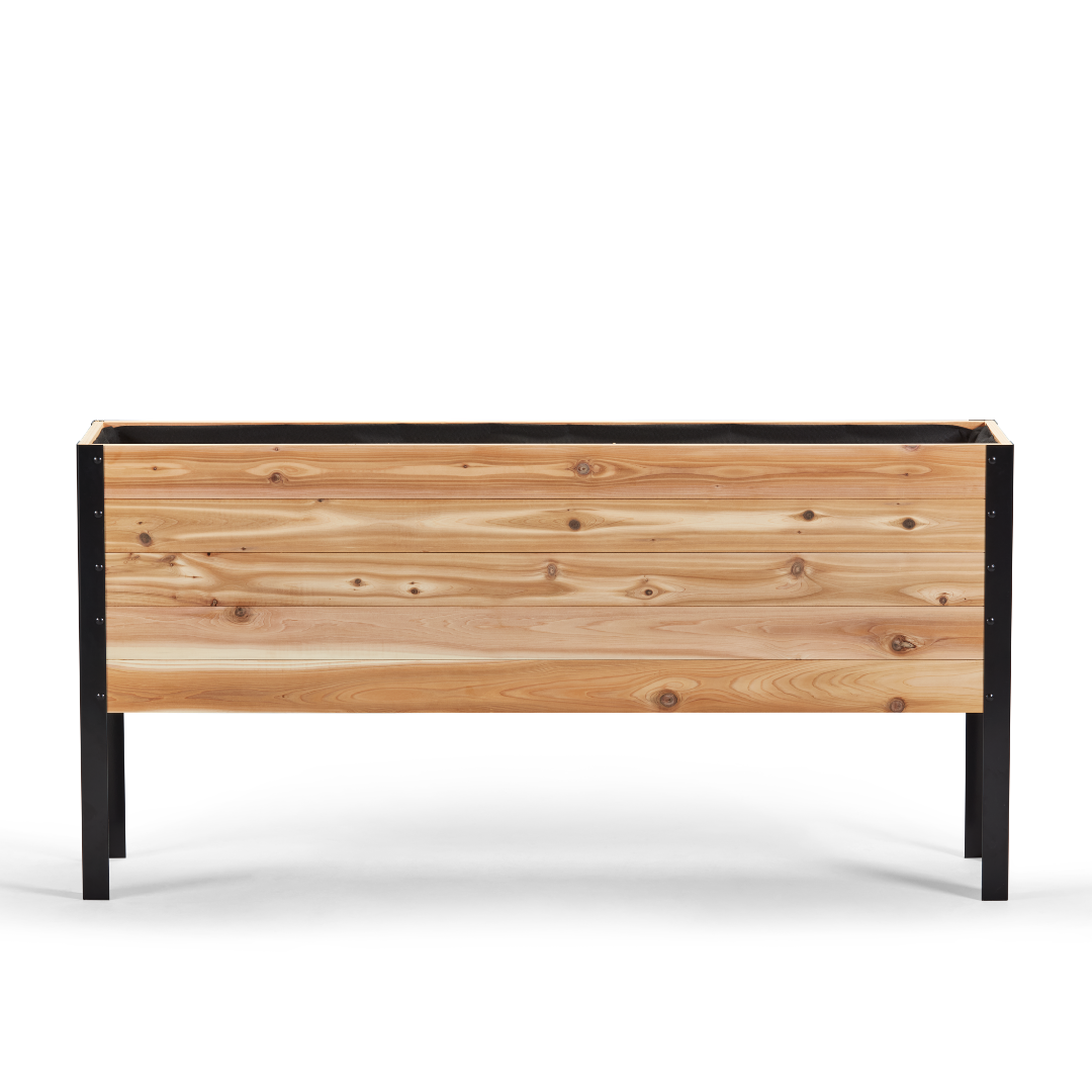 Wooden planter box with black metal frame on a white background